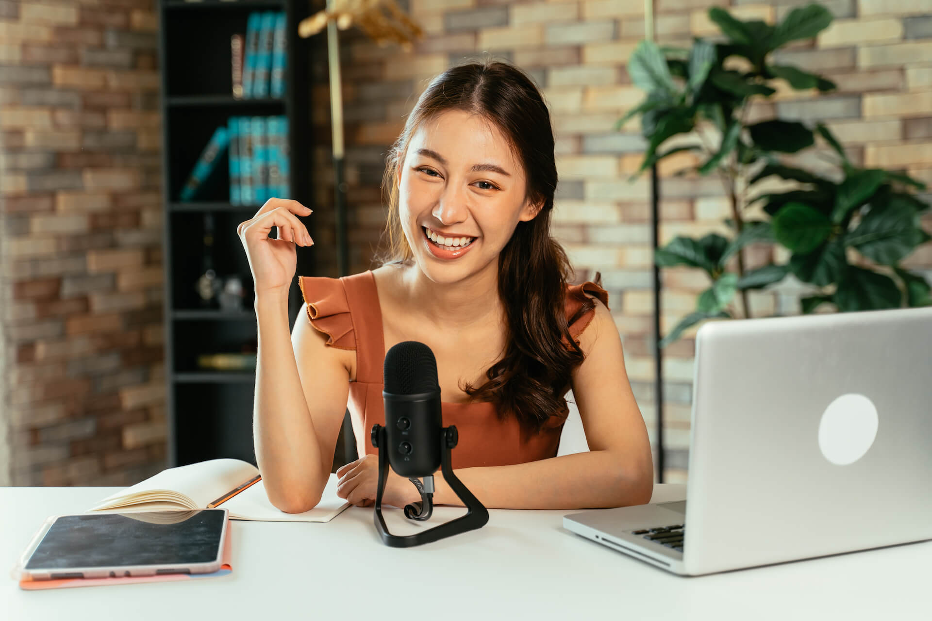 cheerful-blogger-using-mic-for-podcast-2021-09-04-03-50-49-utc.jpg